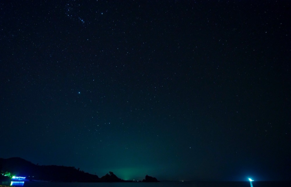 Starry night sky over the sea
